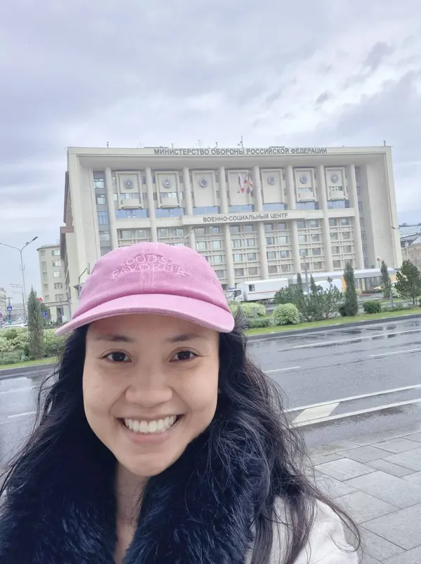 Selfie in front of a large building on the first day in Russia